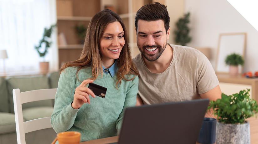 Couple with laptop and credit card